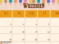 Kalendarz na wrzesień z sową w czapce absolwenta i kolorowymi kredkami. 1 września to rozpoczęcie roku szkolnego.